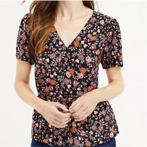 Loft black floral peplum faux wrap short sleeve blouse. Size S